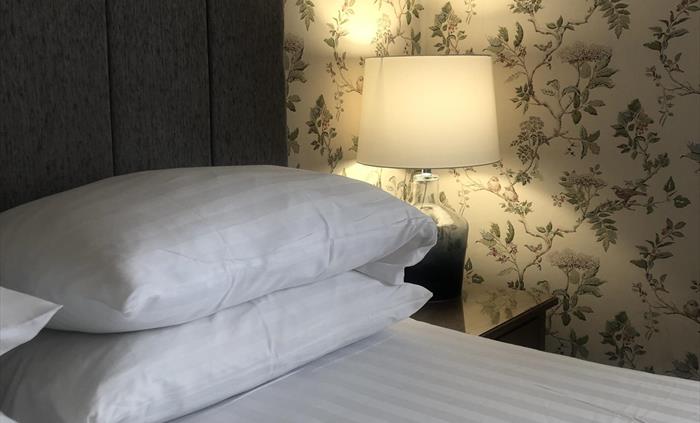 This room is a large king size room with a bay window. It boasts a shower room with rainfall shower